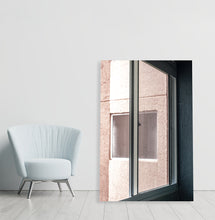 Load image into Gallery viewer, Photo from inside a window facing a pink building
